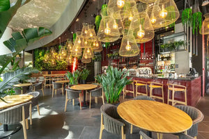 Evo Wooden Highstool with Round Tables and Chairs in Restaurant Setting