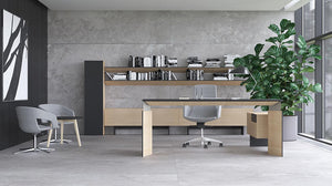Narbutas Move and Lead Executive Desk in Light Oak Finish with Grey Armchair Black Top Coffee Table in Office Setting