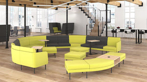 Arcipelago Modular Seating with Wooden Coffee Table and Acoustic Ceiling Lights in Reception Setting