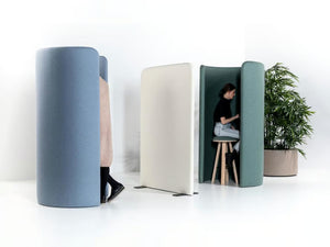 BuzziHug Standing Workstation Pod with Indoor Plant and Freestanding Screen in Studio Setting