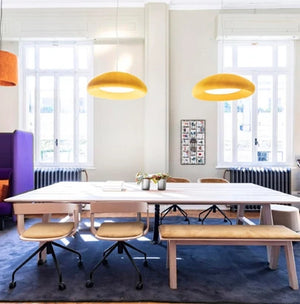 Buzzipicnic Desk 2 In Wood Finish With Yellow Ceiling Light And Bench In Breakout Area