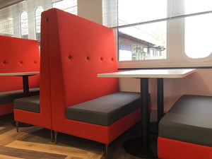 Colin Banquet Seating In Red Finish With White Table In Cafeteria Setting