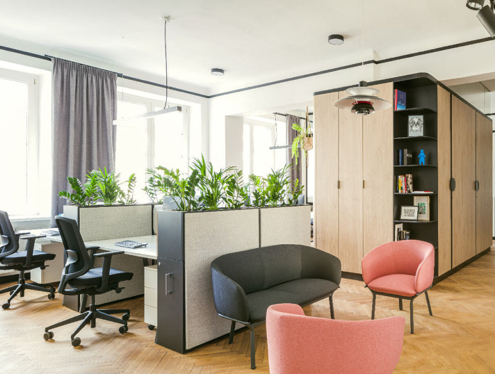 Ergonomic Chair Office Furniture In Black Finish With Upholstered Sofa And Filing Cabinet In Office Setting