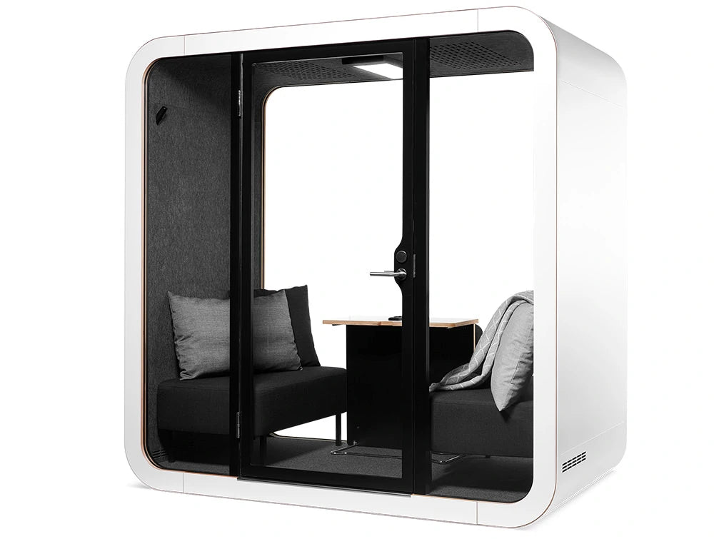 Framery Smart Office Acoustic Meeting Pod With Black Sofas And Grey Pillows