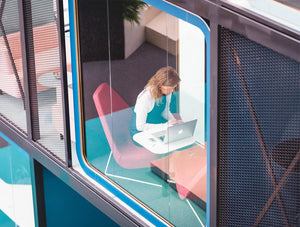 Framery Smart Office Acoustic Meeting Pod With Red Chairs And White Table