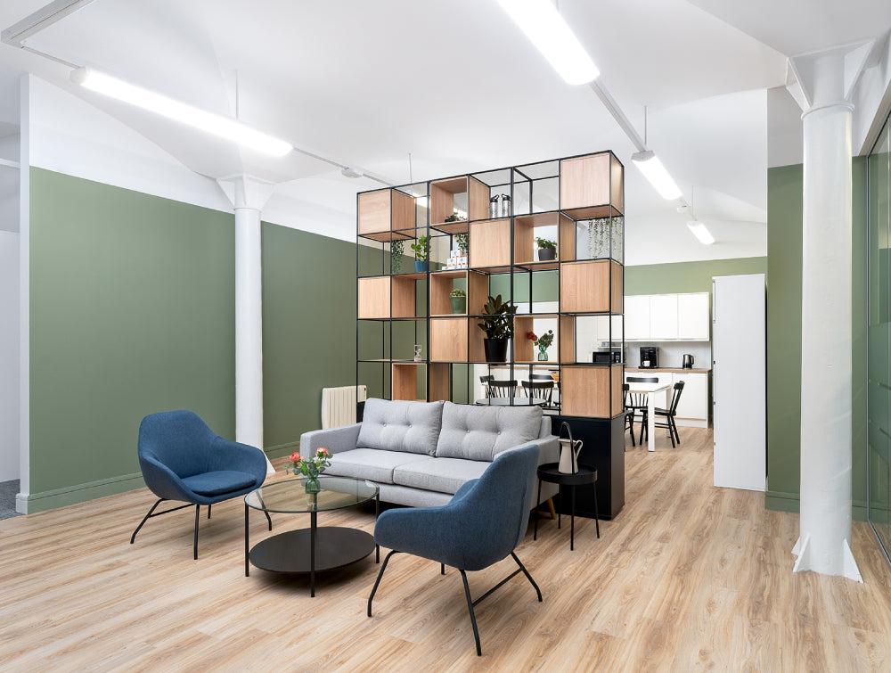 Glass Top Coffee Table With Side Table And Lounge Chair In Breakout Setting