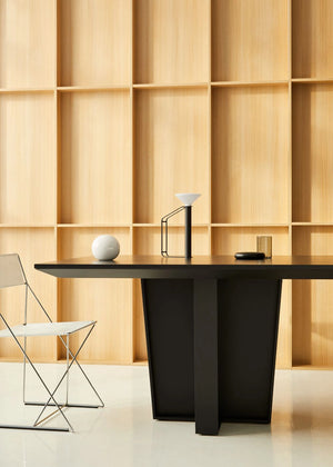 Gravos Conference Table in Black with White Metal Chair in Modern Office Setting