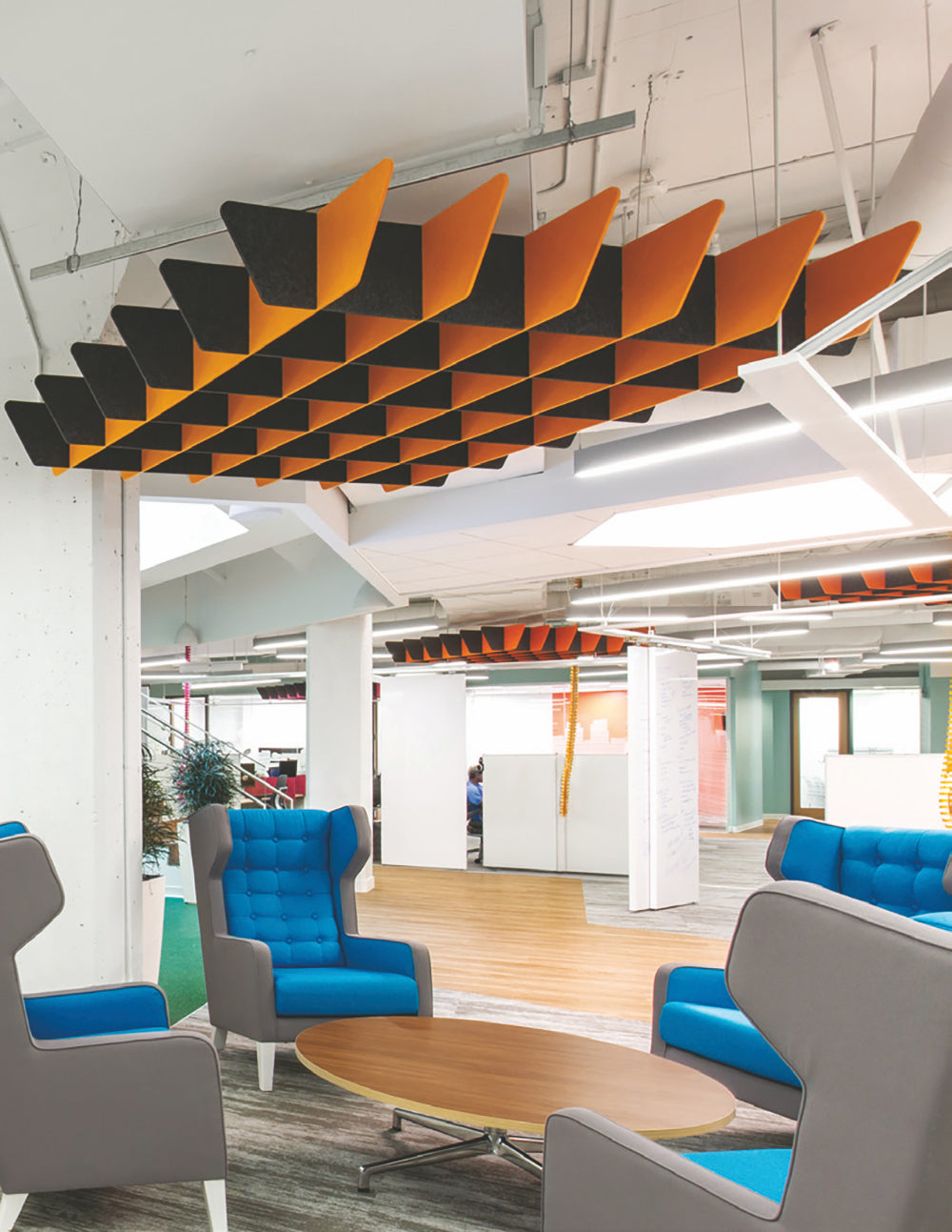 Ezoboard Grid Canopy Acoustic Hanging Unit In Black Finish With Two Toned High Back Armchair And Oval Top Wooden Table In Breakout Setting