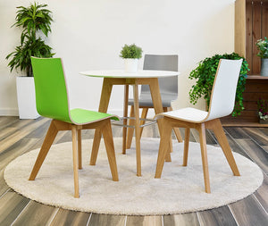 Jinx Cafeteria Chair In Oak Leg Finish With White Round Table Plant Pot In Living Room Setting