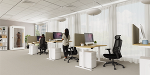 Leap Single Bamboo Sit Stand Desk with White Pedestal and Black Mesh Back Amrchair in Modern Office Setting