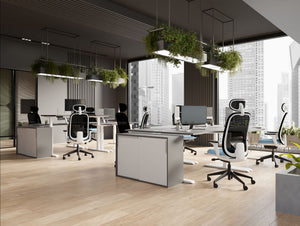 Levo Sit Stand Desks in Grey and White Finish with Contour Ergonomic Chair and Key Side Storage in Modern Office Setting 2