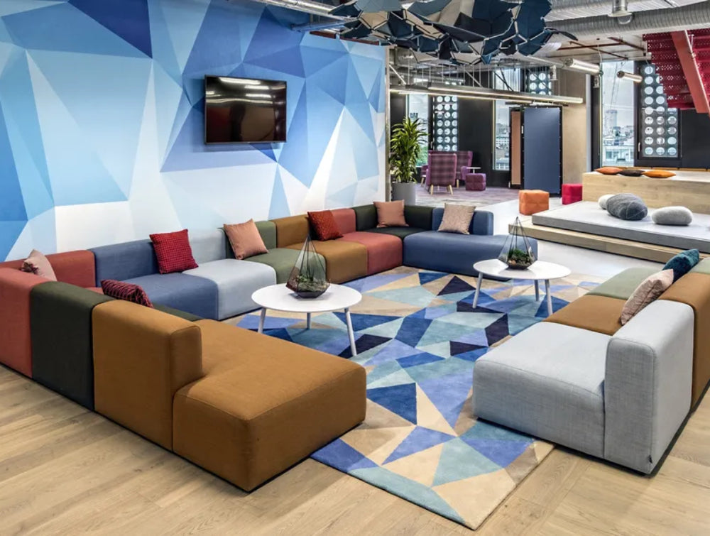 Modular Sofa Office Furniture In Brown Finish With Round Coffee Table In Reception Setting