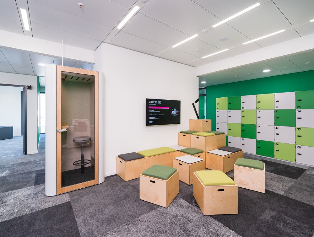 Phone Booth Office Furniture With Pouffe And White Finish Locker In Breakout Setting