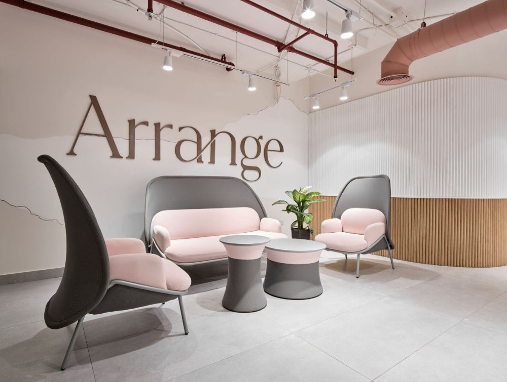Round Coffee Table Office Furniture With High Back Lounge Chair And Indoor Plant In Reception Setting