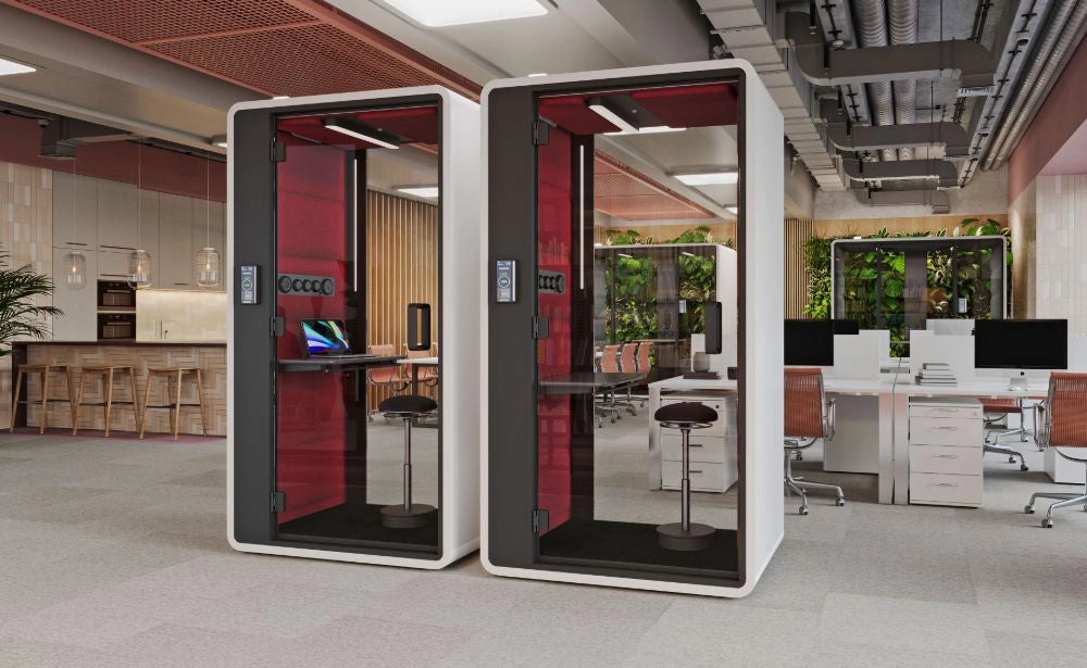 Smart Office Hush Free S Acoustic Phonebooth in White with Red Interior with Black Top Table and Black Movement Stool in Modern Office Setting