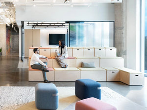 Spacestor Modular Zoning Wooden Bleacher System in Pink and White Top with Colourful Pouffe