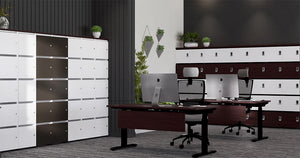 Uno Locker in Two Toned Finish with Dark Wooden Sit Stand Desk and Glass White Vase in Executive Setting