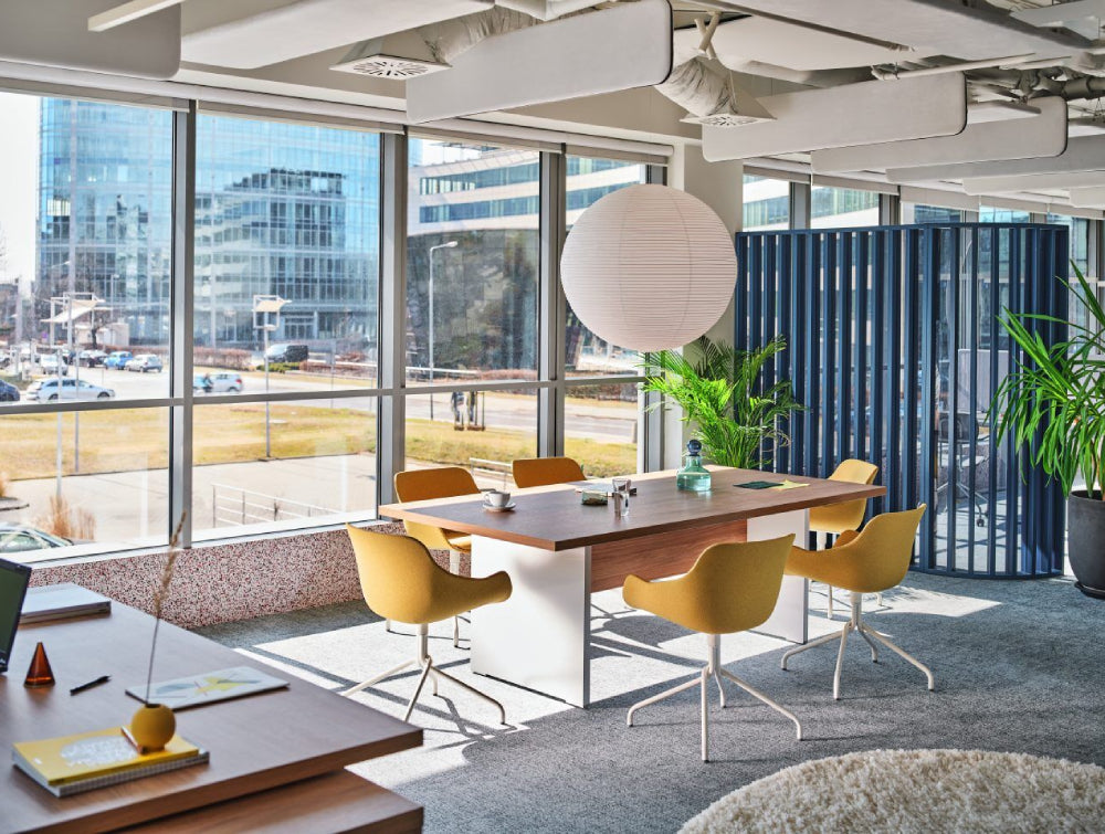Upholstered Armchair Office Furniture With Wooden Table And Indoor Plant In Executive Settting