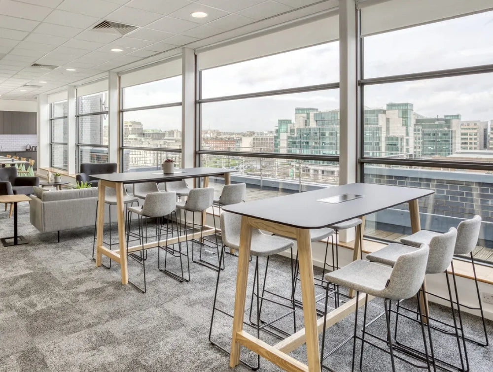 Upholstered High Stool Office Furniture In Light Grey Finish With High Table And Sofa In Breakout Setting