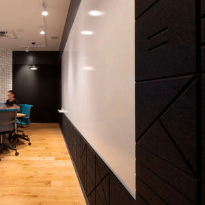 Ezoboard V Notch Wall Panels In Black Finish With Ceiling Light And Blue Armchair In Boardroom Setting