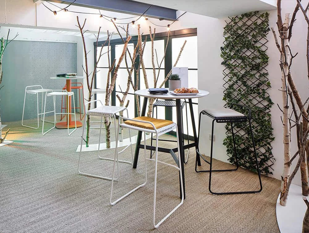 Veck Tubular Framed High Stool In Reception Area With Round Table And Seat Pad Orange Yellow White And Black Finishes